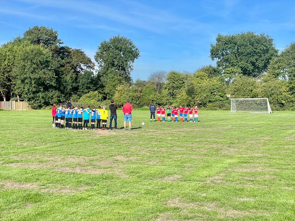 Under 11 Whites paying their respect to the Queen